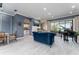 Elegant living room featuring tiled floors, a decorative fireplace, and access to outdoor entertainment area at 1111 Myrtle Breezes Ct, Fruitland Park, FL 34731