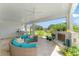 A beautifully furnished outdoor living space with a fireplace and seating offers an inviting setting at 1111 Myrtle Breezes Ct, Fruitland Park, FL 34731