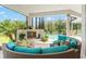 Screened patio featuring outdoor seating, a fireplace, and a view of the sparkling pool at 1111 Myrtle Breezes Ct, Fruitland Park, FL 34731