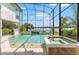 The pool and spa provide endless entertainment options, all within a screened in lanai at 1111 Myrtle Breezes Ct, Fruitland Park, FL 34731