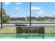 Waterfall feature in the pool adds a touch of elegance to the outdoor space, and a fun crocodile! at 1111 Myrtle Breezes Ct, Fruitland Park, FL 34731