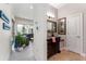 Elegant powder room with rich wood vanity and stylish decor at 1111 Myrtle Breezes Ct, Fruitland Park, FL 34731