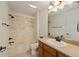Bathroom featuring a vanity, mirror, bathtub, and shower at 1329 Gaston Loop, The Villages, FL 32162