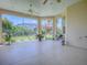 This screened lanai boasts beautiful views of the back yard and natural light at 1454 Neuport Path, The Villages, FL 32163
