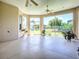 This screened lanai boasts beautiful views of the back yard with plenty of natural light at 1454 Neuport Path, The Villages, FL 32163