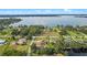 Stunning aerial view of the property showcasing its proximity to the lake and lush surroundings at 16200 E Shirley Shores Rd, Tavares, FL 32778