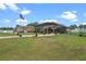 A spacious backyard features a metal storage shed, screen enclosed pool, and well kept lawn at 16200 E Shirley Shores Rd, Tavares, FL 32778
