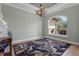 Dining room featuring a decorative rug, chandelier, and large window offering natural light and views of the outdoors at 16200 E Shirley Shores Rd, Tavares, FL 32778