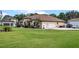 Charming single-Gathering home with an expansive lawn, tile roof, and multiple car garage at 16200 E Shirley Shores Rd, Tavares, FL 32778