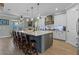 Gourmet kitchen featuring a large center island with barstool seating and modern appliances at 16200 E Shirley Shores Rd, Tavares, FL 32778