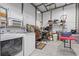 Spacious laundry room featuring modern washer and dryer, utility sink, and ample storage shelving for an organized space at 16200 E Shirley Shores Rd, Tavares, FL 32778