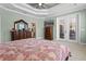 Airy main bedroom offering generous space, walk-in closet and private access to outdoor seating at 16200 E Shirley Shores Rd, Tavares, FL 32778
