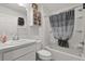 Bright bathroom with a shower-tub combo and lots of storage in white cabinets at 1633 Manserra St, The Villages, FL 32163