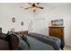 Inviting bedroom featuring a ceiling fan and natural light at 1633 Manserra St, The Villages, FL 32163