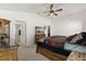 Relaxing bedroom with lots of natural light, a ceiling fan, and a TV for entertainment at 1633 Manserra St, The Villages, FL 32163