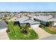 This home boasts a well-manicured lawn and landscaping, enhancing its curb appeal in a peaceful neighborhood at 1633 Manserra St, The Villages, FL 32163