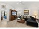 Comfortable living room featuring stylish furnishings and a media center at 1633 Manserra St, The Villages, FL 32163