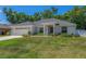 Inviting single-story home features well maintained landscaping, and a two-car garage at 16380 Se 84Th Ct, Summerfield, FL 34491