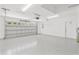 Clean and spacious garage with epoxy flooring, storage and automatic door opener at 16380 Se 84Th Ct, Summerfield, FL 34491