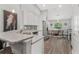 Bright kitchen with stainless steel appliances and a dining area at 16380 Se 84Th Ct, Summerfield, FL 34491