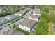 An aerial view of a home in its community showing the roof, pool, landscaping, and parking area at 17519 Hidden Forest Dr, Clermont, FL 34714