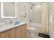Well-lit bathroom with a shower-tub combination and modern fixtures at 17519 Hidden Forest Dr, Clermont, FL 34714