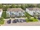 A modern townhome complex with well-maintained landscaping and convenient parking at 17519 Hidden Forest Dr, Clermont, FL 34714