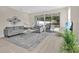 Cozy living room that provides sliding glass doors to the outdoor living space at 17519 Hidden Forest Dr, Clermont, FL 34714