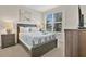 Inviting bedroom with neutral tones, natural light, and modern furnishings at 17519 Hidden Forest Dr, Clermont, FL 34714