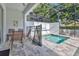 Backyard patio with a screened-in pool area, table seating, and ample space for outdoor relaxation at 17519 Hidden Forest Dr, Clermont, FL 34714