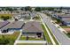 Aerial view of home featuring a fenced backyard and landscaped yard in a residential neighborhood at 456 Winter Solstice Ln, Mount Dora, FL 32757