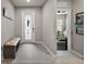 Bright foyer featuring a decorative front door, bench seating, and access to the bedroom at 456 Winter Solstice Ln, Mount Dora, FL 32757