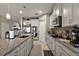 Well-equipped kitchen with granite countertops, stainless steel appliances, and ample cabinet space at 456 Winter Solstice Ln, Mount Dora, FL 32757