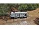 Modern RV on lot ready for travel with awning and outdoor kitchen at 5787 Marion County Rd, Lady Lake, FL 32159