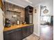 Custom bar area features a built-in beverage cooler, wooden countertops and stylish decor at 602 Cr 489, Lake Panasoffkee, FL 33538