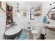 Charming bathroom with a clawfoot tub, vessel sink, decorative shelving, and stylish accents at 602 Cr 489, Lake Panasoffkee, FL 33538