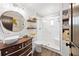 Updated bathroom with a new vanity, a glass enclosed shower, and built-in shelving at 602 Cr 489, Lake Panasoffkee, FL 33538