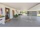 Spacious covered parking area featuring stylish decor, providing ample space and protection for vehicles at 602 Cr 489, Lake Panasoffkee, FL 33538