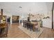 Open dining area with wood floors, chandelier, large table and decor at 602 Cr 489, Lake Panasoffkee, FL 33538