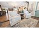 Comfortable living area featuring striped chairs and decor, adjacent to kitchen and dining space at 602 Cr 489, Lake Panasoffkee, FL 33538