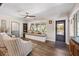 Cozy living room with arm chairs, built-in bench with pillows, and access to a door at 602 Cr 489, Lake Panasoffkee, FL 33538