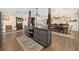 Open floor plan featuring a kitchen island, dining area and a rustic sliding barn door at 602 Cr 489, Lake Panasoffkee, FL 33538