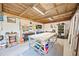 Well-organized workshop featuring workbenches, tool storage, and ample space for projects at 602 Cr 489, Lake Panasoffkee, FL 33538