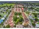 This aerial view shows the community layout, including the pool and landscaping in relation to surrounding neighborhoods at 632 Delgado Ave, The Villages, FL 32159