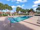 Sparkling community pool with lounge chairs, manicured landscaping and clear, refreshing water for residents at 632 Delgado Ave, The Villages, FL 32159