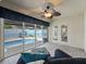 The sun room overlooks a crystal clear pool with lounge seating and a fountain at 632 Delgado Ave, The Villages, FL 32159
