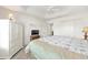 Bright bedroom boasts a ceiling fan, a dresser and closet at 857 Enisgrove Way, The Villages, FL 32163