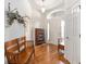 Inviting foyer with light wood floors and a bright, welcoming atmosphere at 857 Enisgrove Way, The Villages, FL 32163