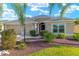 Beautiful single story home featuring a well-maintained lawn and a two-car garage at 857 Enisgrove Way, The Villages, FL 32163