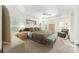 Spacious main bedroom featuring a tray ceiling, ceiling fan, and multiple windows at 857 Enisgrove Way, The Villages, FL 32163